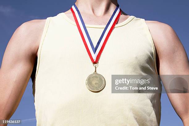 . athlete with gold medal - abzeichen stock-fotos und bilder