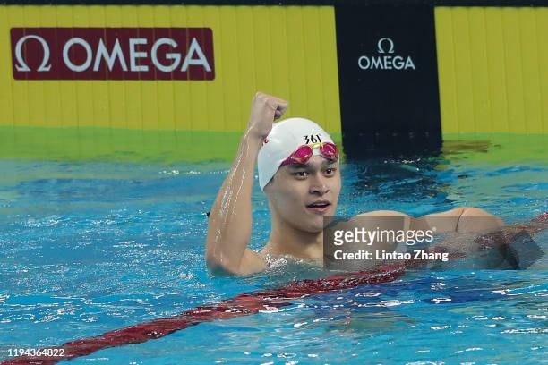Sun Yang of China celebrates winning the gold medal after competing in the Men's 200m Freestyle Final during the day one of FINA Champions Swim...