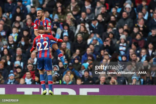 Cenk Tosun of Crystal Palace celebrates after scoring a goal to make it 0-1 during the Premier League match between Manchester City and Crystal...