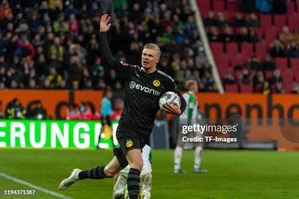 Erling Haaland of Borussia Dortmund celebrates after scoring his team's second goal during the Bundesliga match between FC Augsburg and Borussia...