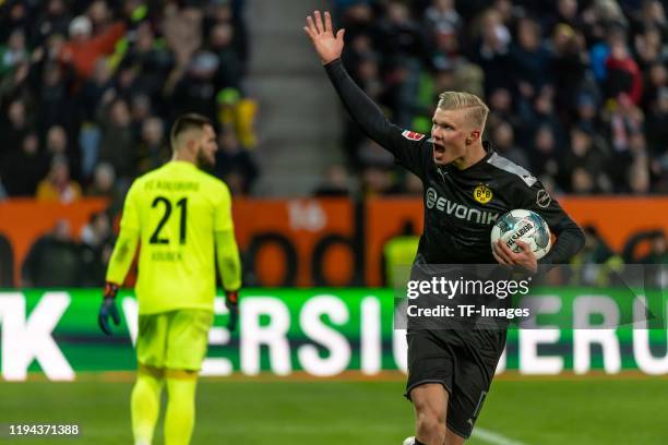 Erling Haaland of Borussia Dortmund celebrates after scoring his team's second goal during the Bundesliga match between FC Augsburg and Borussia...