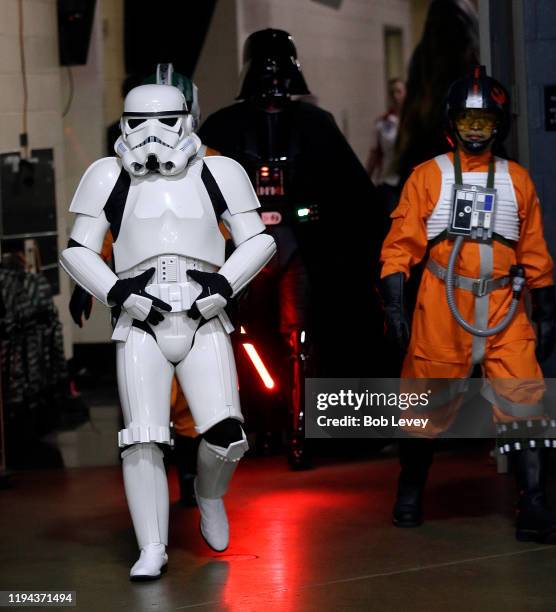 Storm trooper, rebel pilot and Darth Vader appear at Star Wars Night at Toyota Center on December 16, 2019 in Houston, Texas. NOTE TO USER: User...