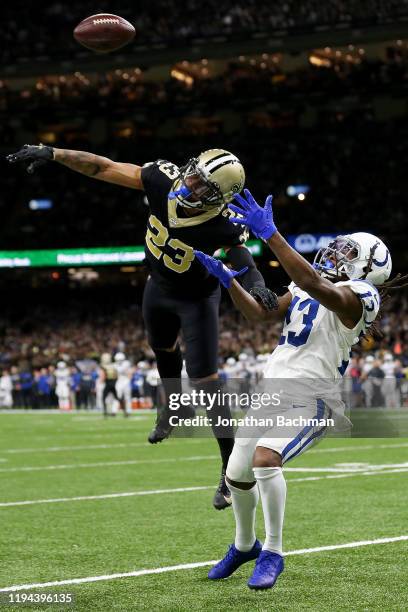 Cornerback Marshon Lattimore of the New Orleans Saints breaks up a pass intended for wide receiver T.Y. Hilton of the Indianapolis Colts at Mercedes...