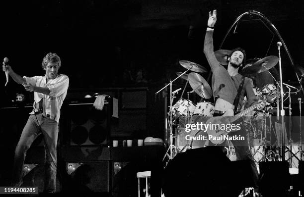 English Rock musicians Roger Daltry , on vocals, and Pete Townshend, on guitar, both of the group the Who, perform onstage at the International...