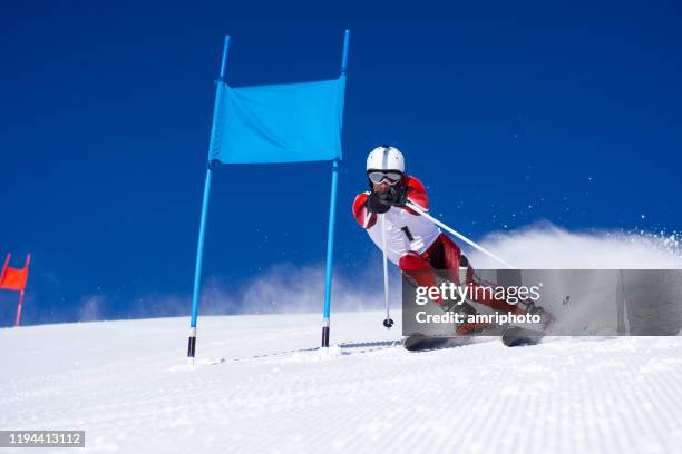professional alpine skier during super g skiing - professional skier stock pictures, royalty-free photos & images