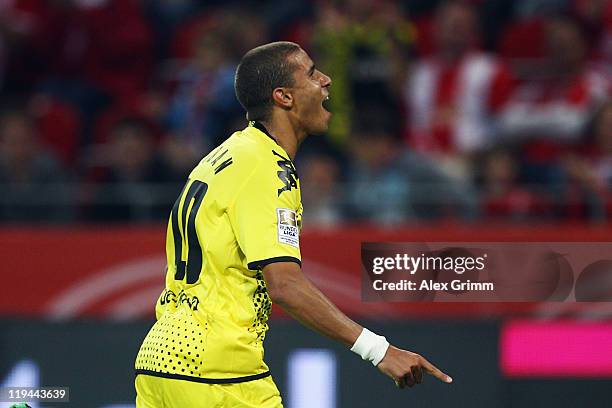 Mohamed Zidan of Dortmund celebrates his team's second goal during the LIGA total! Cup final match between Hamburger SV and Borussia Dortmund at...
