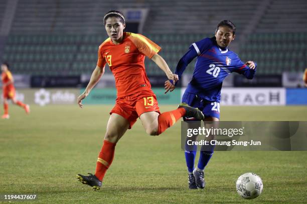 Song Duan of China competes for the ball with Lee Wan-Chen of Chinese Taipei during the Women's EAFF E-1 Football Championship match between Chinese...