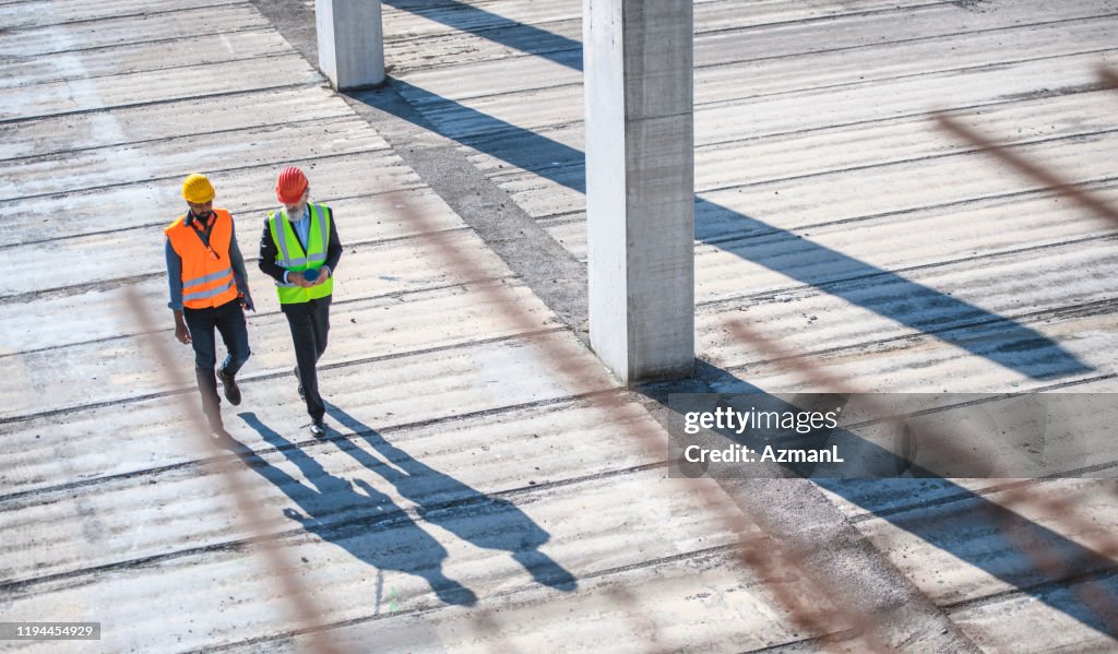 High Angle View of Construction Site Colleagues