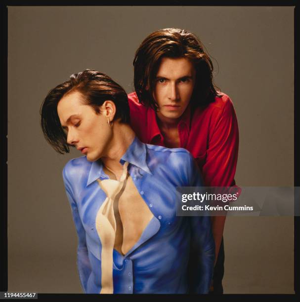 Singer Brett Anderson and guitarist Bernard Butler of British band Suede, March 1993; Anderson's shirt and tie are painted onto his chest.