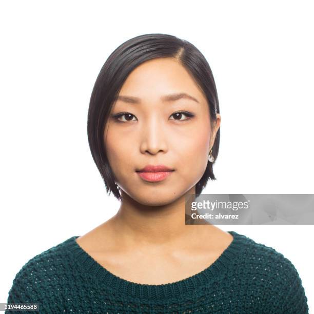portrait of a confident young asian woman - serious face stock pictures, royalty-free photos & images