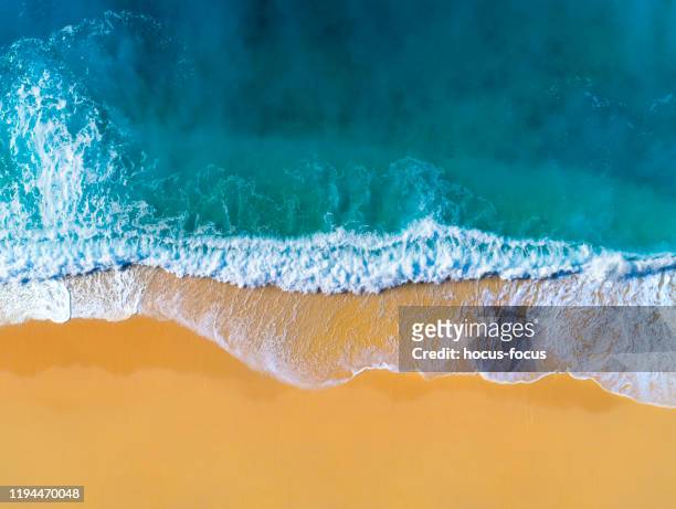 aerial view of clear turquoise sea and waves - australia coastline stock pictures, royalty-free photos & images