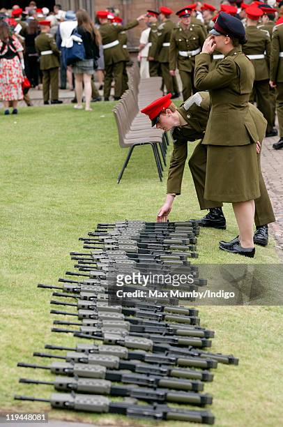 Soldiers of the guard of honour place their rifles on the ground prior to attending attend the Royal Mercian and Lancastrian Yeomanry Homecoming...