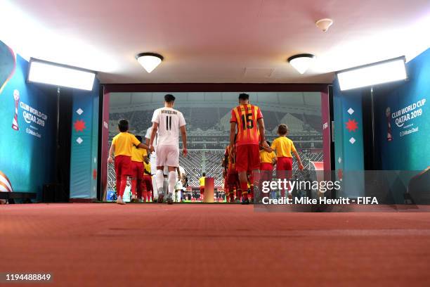 The two sides make their way out of the tunnel during the FIFA Club World Cup 2019 5th place match between Al-Saad Sports Club and Esperance Sportive...