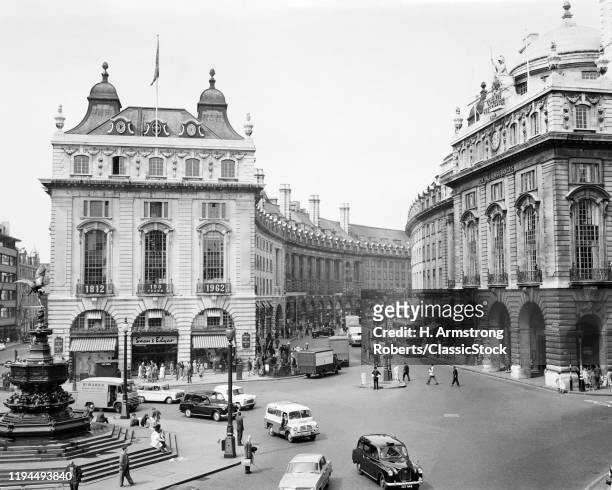 1960s PEDESTRIANS AND CARS MOVING AROUND PICCADILLY CIRCUS 1819 WITH A VIEW TO THE REGENT STREET QUADRANT LONDON ENGLAND