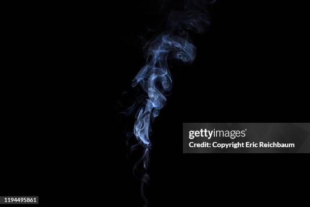 whitee smoke billows up on a black background - tobacco product stock-fotos und bilder