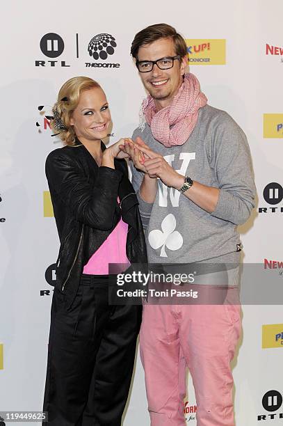 Host Mirjam Weichselbraun and tv host Joachim 'Joko' Winterscheidt arrive at 'The Dome 54' at Schleyerhalle on May 20, 2010 in Stuttgart, Germany.