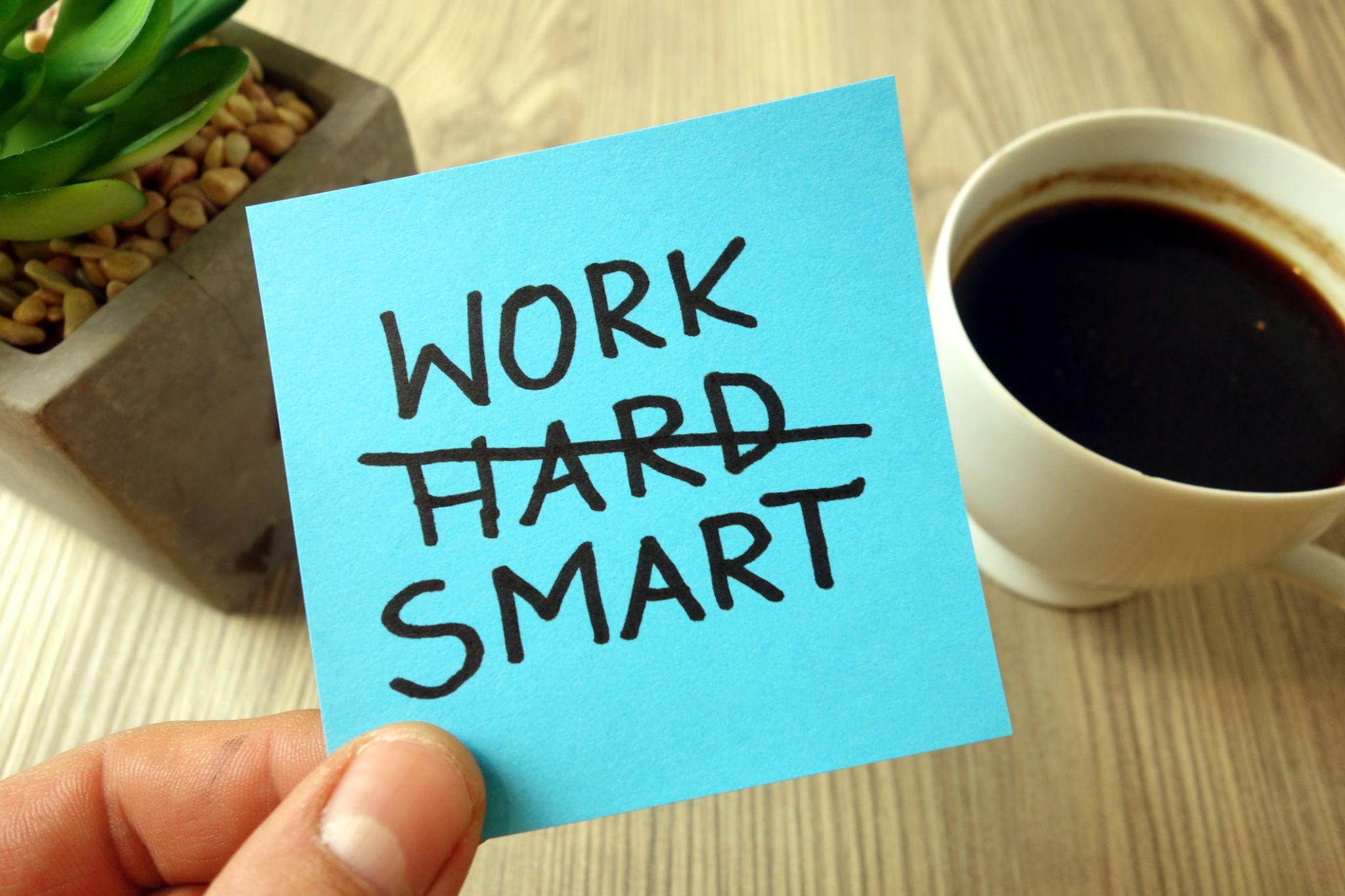 Work smart - motivational reminder handwritten on sticky note Work smart - motivational reminder handwritten on sticky note