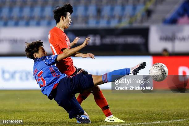 Kim Hyeri of South Korea competes for the ball with Tanaka Mina of Japan during the EAFF E-1 Football Championship match between South Korea and...