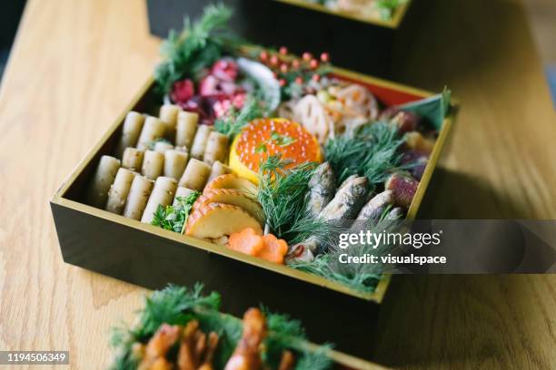 japanese new year's eve food osechi ryori - osechi ryori stock pictures, royalty-free photos & images