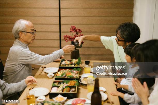 celebrating with family - new year japan stock pictures, royalty-free photos & images