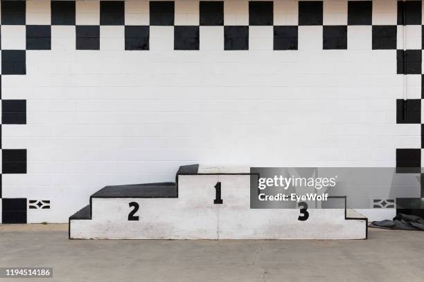a beat up award podium at a race track - winners podium stock pictures, royalty-free photos & images