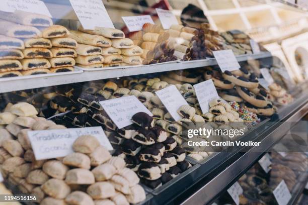 traditional maltese fig rolls for sale at a bakery selling only cookies in rabat, malta - mdina stock pictures, royalty-free photos & images