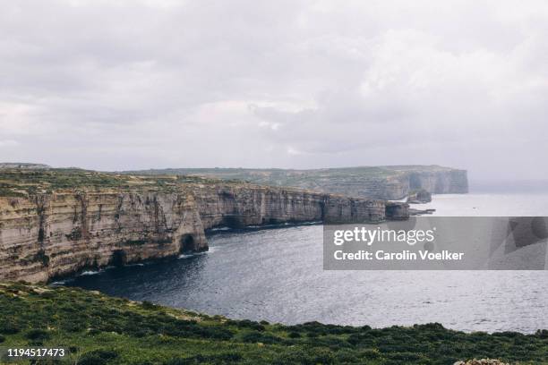 coastline on gozo island with impressive limestone cliffs - azure window malta stock pictures, royalty-free photos & images