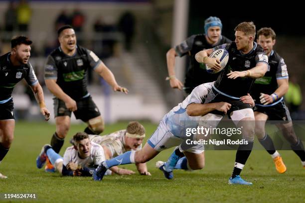 Rob Webber of Sale Sharks in action with Glenn Bryce of Glasgow Warriors during the Heineken Champions Cup Round 6 match between Sale Sharks and...