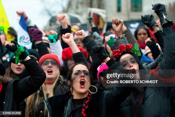 Women inspired by the Chilean feminist group Las Tesis dance during the 4th annual Womens March in Washington, DC, on January 18, 2020. - "The Rapist...