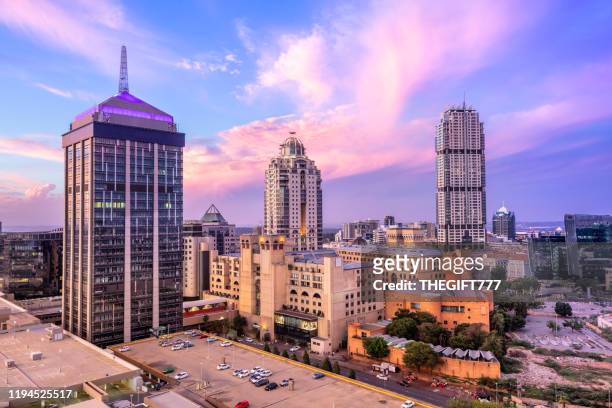 sandton city centre at sunset with nelson mandela square - south africa stock pictures, royalty-free photos & images