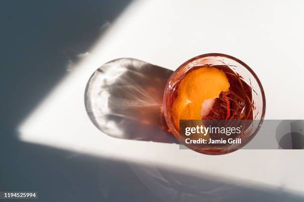 negroni cocktail with shadow - negroni stock pictures, royalty-free photos & images