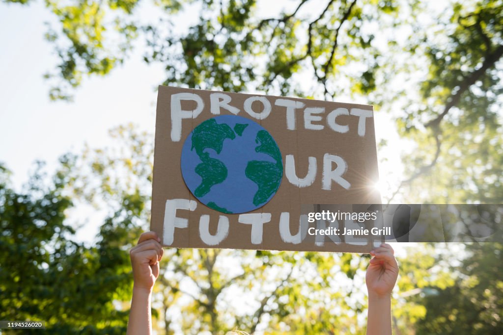 Climate change activist holding sign