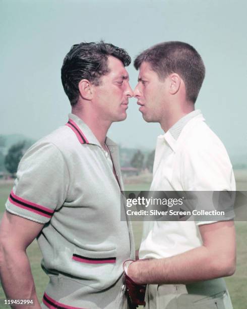 Dean Martin , US actor and singer, with Jerry Lewis, US actor and comedian, squaring up to each other, face to face, USA, circa 1952.