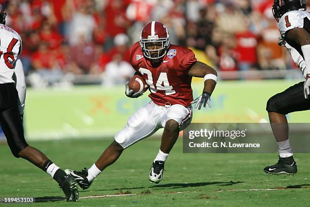 Alabama running back Kenneth Darby looks for running room during a 13-10 victory over the Texas Tech Red Raiders at the AT&T Cotton Bowl in Dallas,...