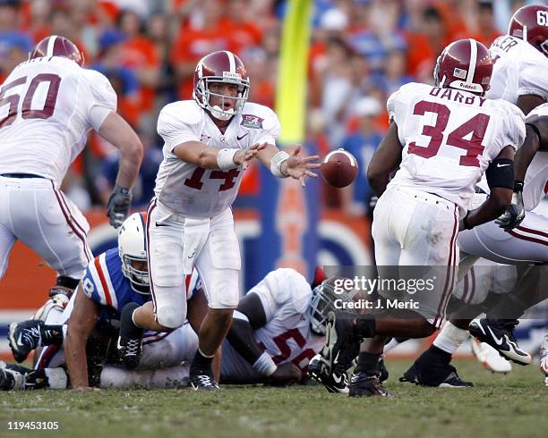 Alabama quarterback John Parker Wilson makes this pitch to Kenneth Darby in Saturday's game against Florida at Ben Hill Griffin Stadium in...