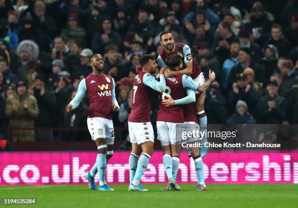 Conor Hourihane of Aston Villa celebrates scoring his teams first goal during the Carabao Cup Quarter Final match between Aston Villa and Liverpool...