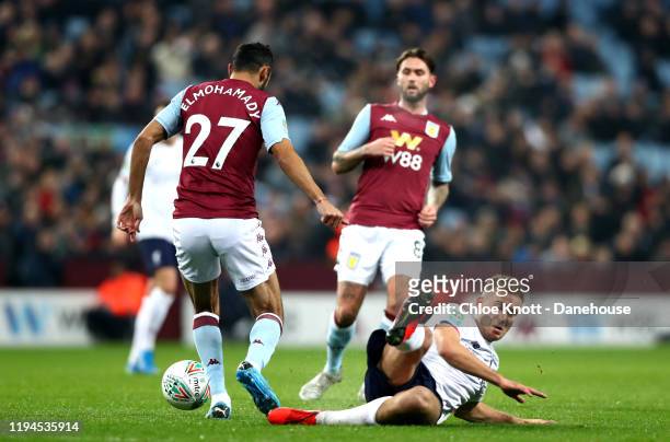 Ahmed El Mohamady of Aston Villa tackles Luis Longstaff of Liverpool FC during the Carabao Cup Quarter Final match between Aston Villa and Liverpool...