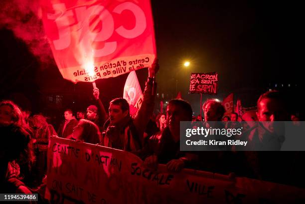 Members of the CGT union march through the streets of Paris chanting against President Macron as thousands take to the streets in support of the...