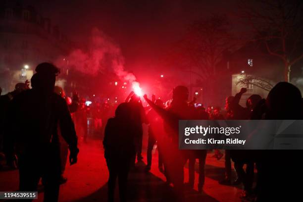 Protestors advance towards French Riot Police at Place de la Nation as thousands take to the streets of Paris in support of the National Strike on a...