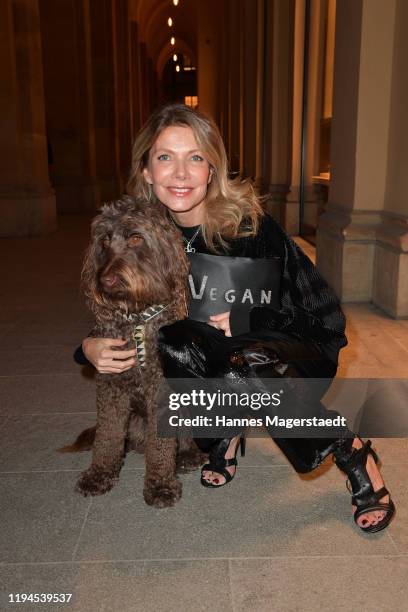 Actress Ursula Karven with her dog Marley attends the Giulia & Romeo Christmas Soiree at Maximilian Arkaden on December 17, 2019 in Munich, Germany.