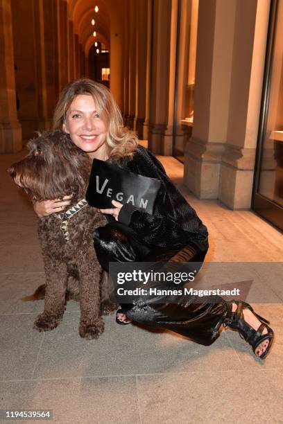 Actress Ursula Karven with her dog Marley attends the Giulia & Romeo Christmas Soiree at Maximilian Arkaden on December 17, 2019 in Munich, Germany.