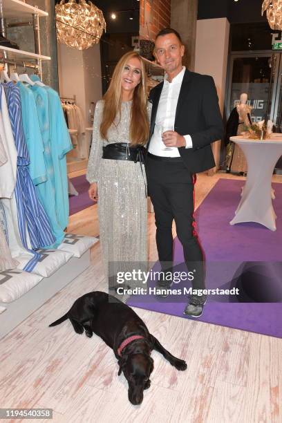Daniela Brunner with her dog Greta and Udo Landow attend the Giulia & Romeo Christmas Soiree at Maximilian Arkaden on December 17, 2019 in Munich,...