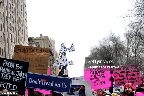 People participate in the annual Women's March in front of the Trump International Hotel on January 18, 2020 in New York City. In the fourth...