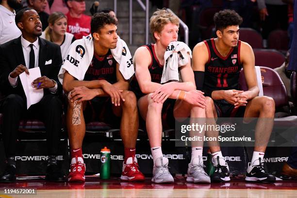 Stanford Cardinal forward Oscar da Silva , Stanford Cardinal forward James Keefe and Stanford Cardinal forward Jaiden Delaire look on dejected on the...