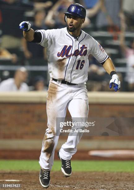 Angel Pagan of the New York Mets reacts after hitting a walk off home run in the tenth inning defeating the St. Louis Cardinals 6-5 on July 20, 2011...