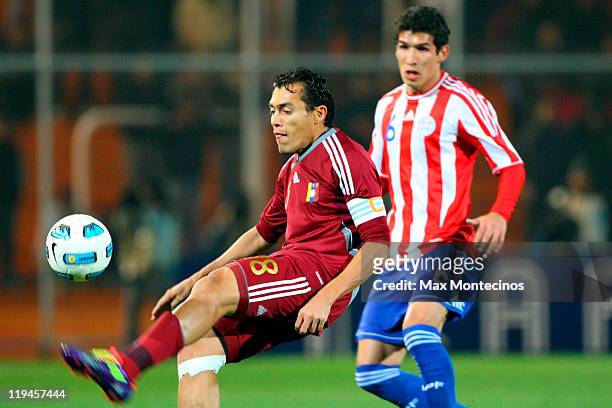 Juan Arango from Venezuela fights for the ball against Marcos Cáceres from Paraguay during a semi final match between Paraguay and Venezuela at...