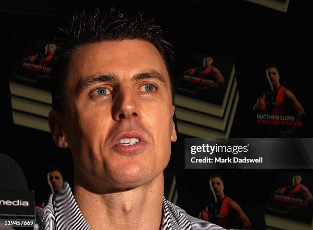 Former Essendon AFL player Matthew Lloyd speaks to the media at the launch of his book 'Straight Shooter' at Windy Hill on July 21, 2011 in...