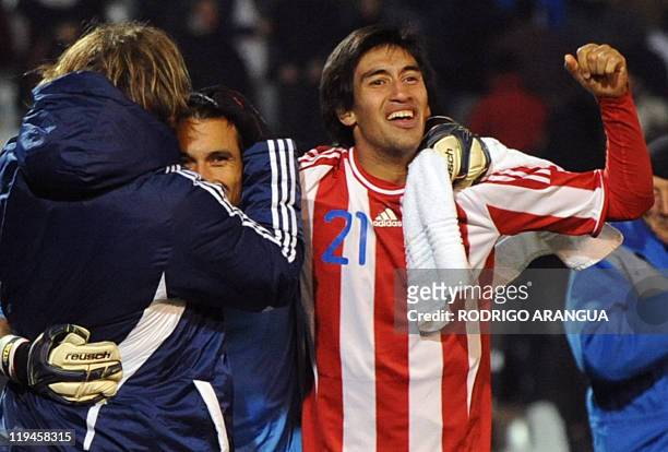 Paraguayan footballers Edgar Barreto, goalie Justo Villar and Marcelo Estigarribia celebrate at the end of their 2011 Copa America semi-final match...