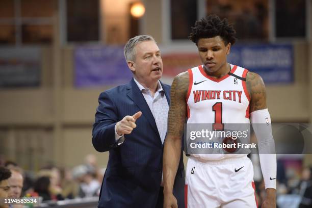 Darren Erman Head Coach of the Windy City Bulls talks to Perrion Callandret of the Windy City Bulls during a G League game between the Erie BayHawks...