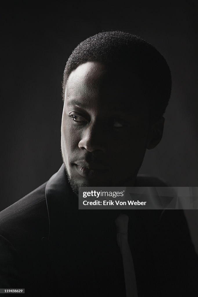 Portrait of adult on black background